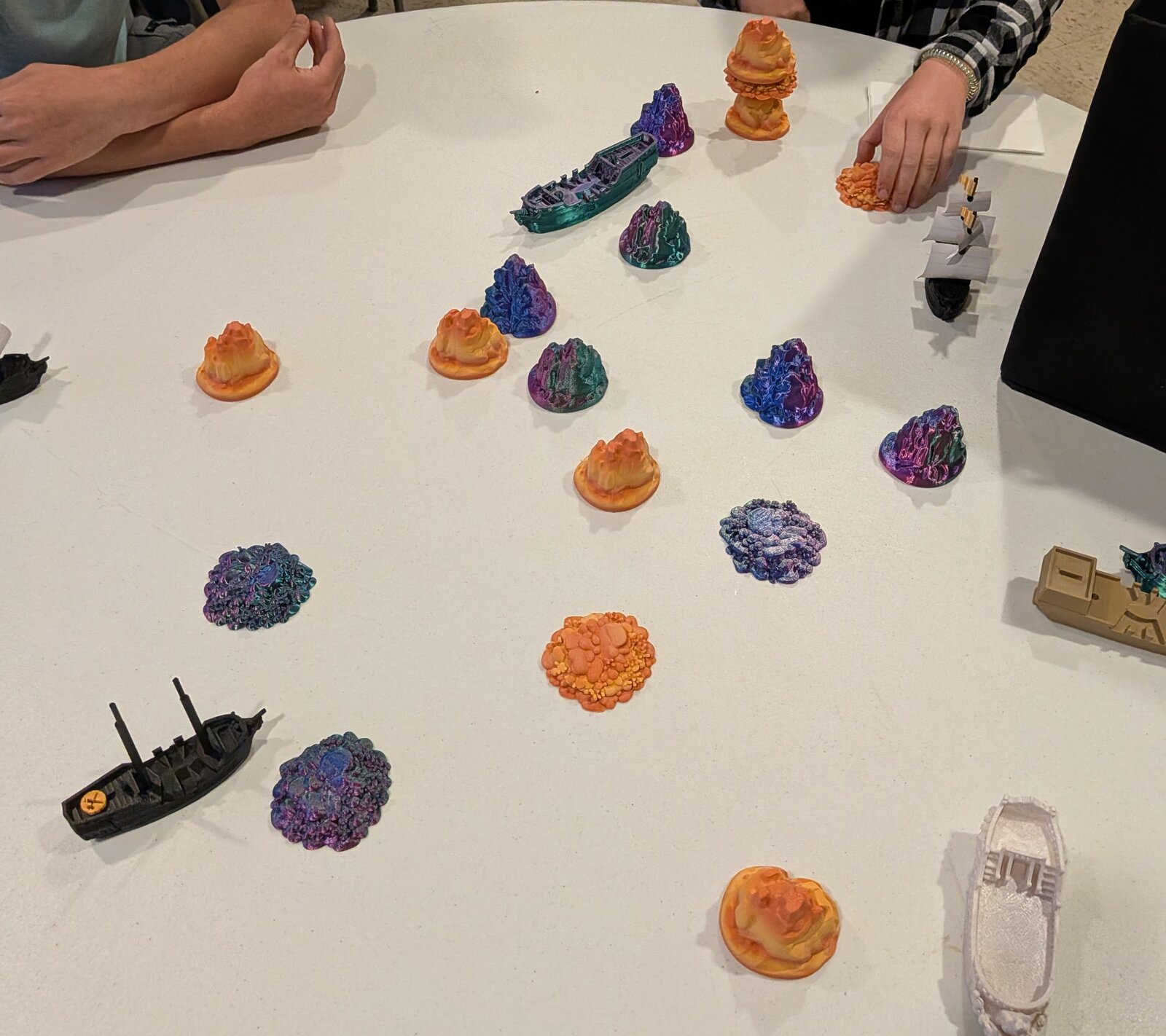 A spread of printed rocks, reefs, and islands used for terrain scale testing.
