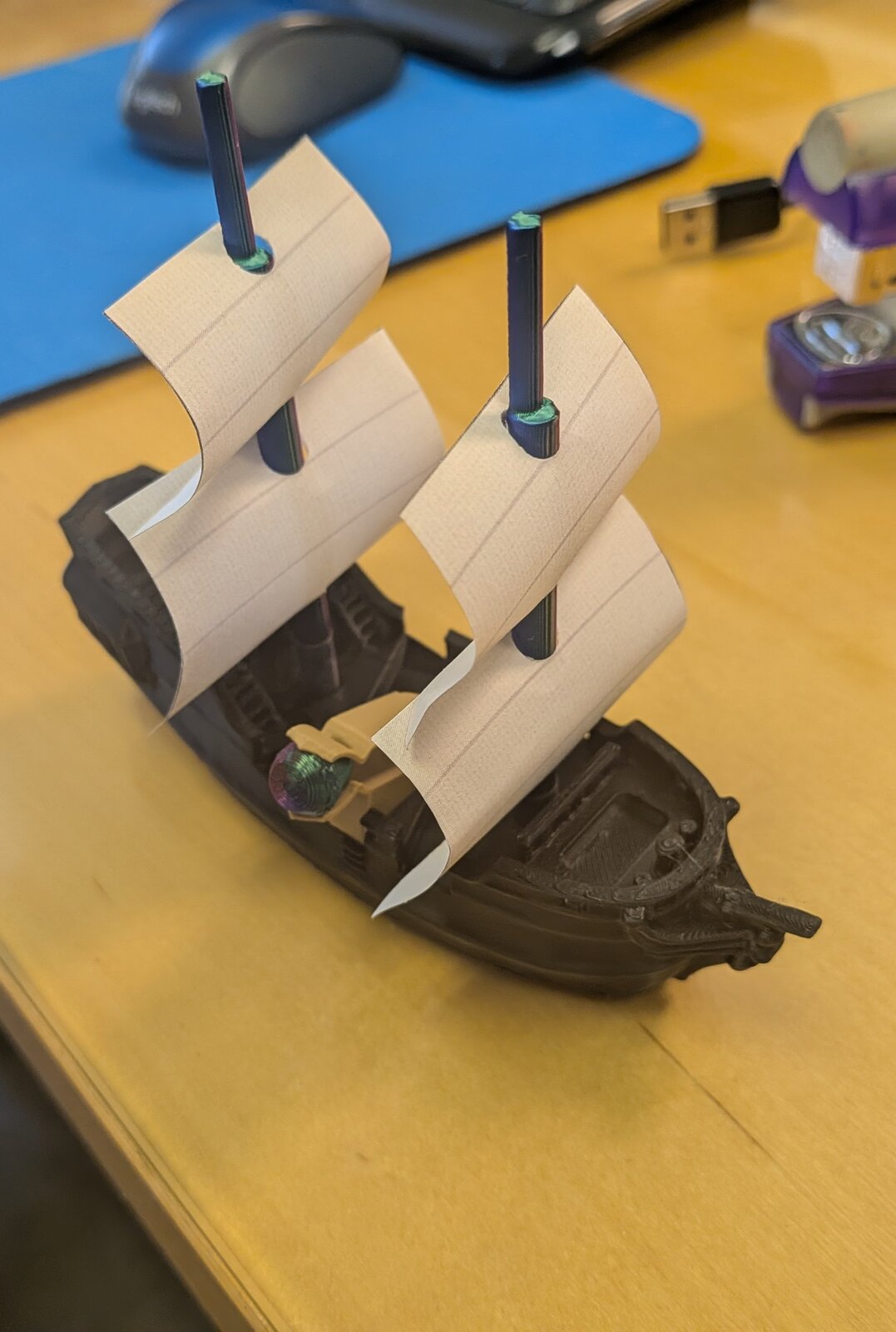 Queen's Fleet ship being used for movement testing on a glass surface.